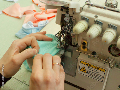 Work on the sewing equipment (close up) photo