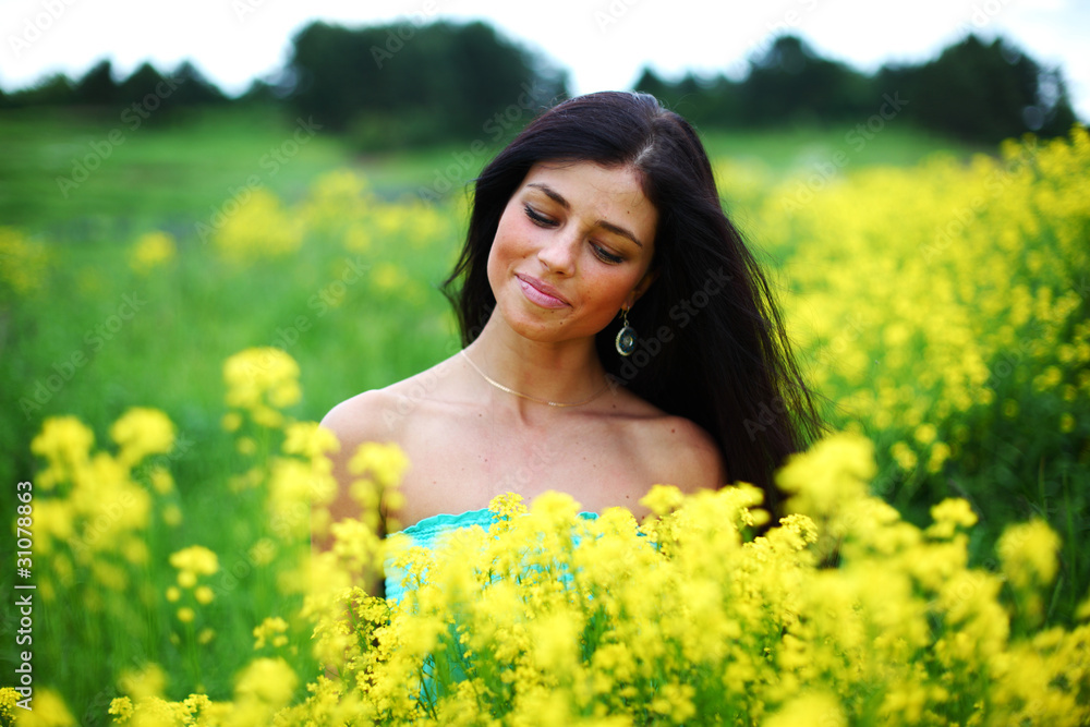 woman on oilseed field woman on oilseed field