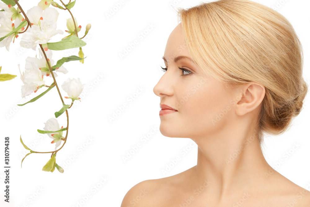 Fototapeta premium beautiful woman with orchid flower