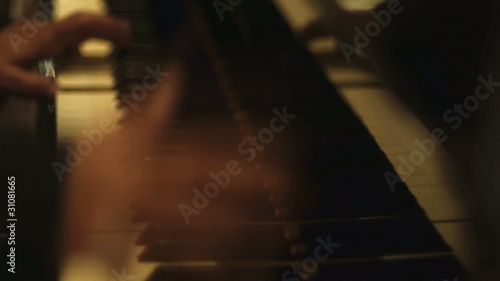 Male hands  playing piano photo