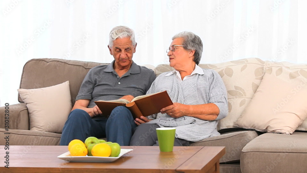 Senior couple looking at their photo album Senior couple looking at their photo album