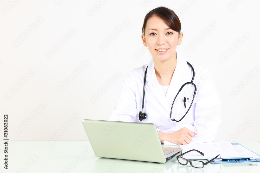 japanese female doctor with laptop computer smiles japanese female doctor with laptop computer smiles