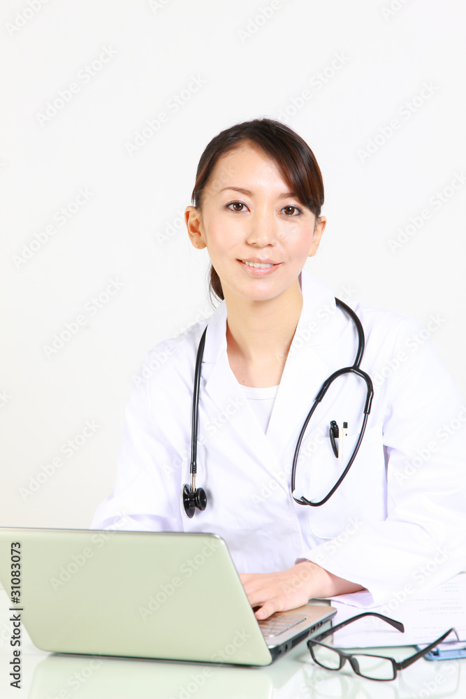 japanese female doctor with laptop computer smiles japanese female doctor with laptop computer smiles
