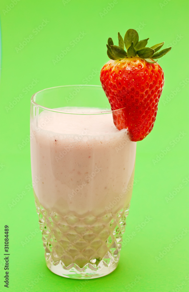 Strawberry milkshake on a green background Strawberry milkshake on a green background