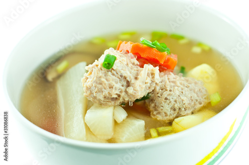 Vegetable soup with pork in white bowl