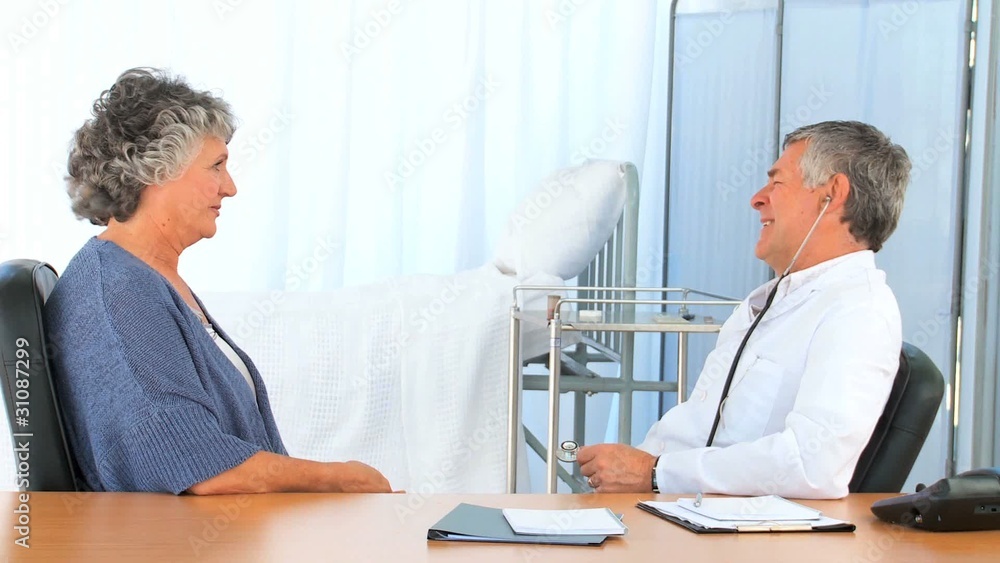Doctor taking the heartbeat of his mature patient Doctor taking the heartbeat of his mature patient