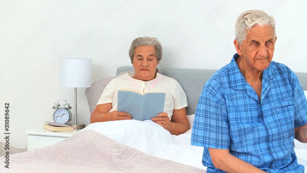 Mature couple in their bedroom Mature couple in their bedroom