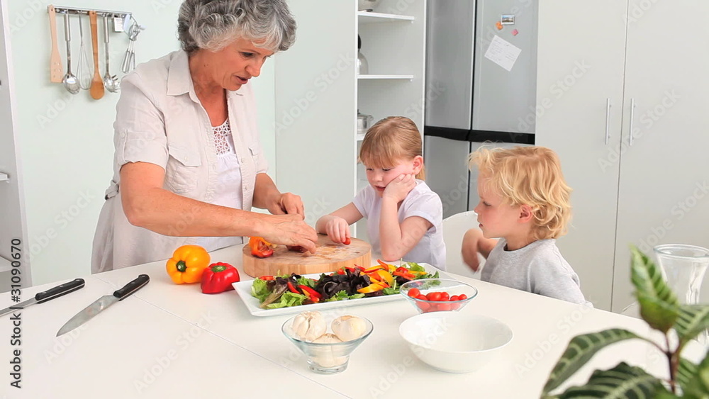 Grandchildren cooking with their Grandmother Grandchildren cooking with their Grandmother