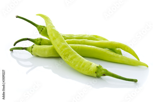 Green chilly on white background