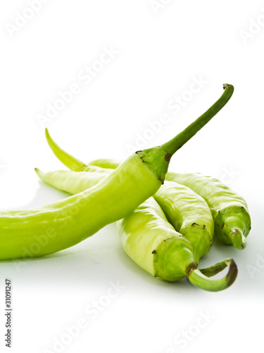 Green chilly on white background