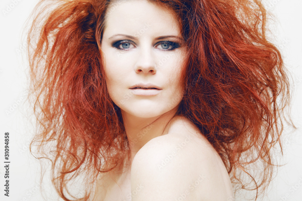 Obraz premium Young fashion model with curly red hair.