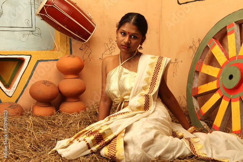 girl clad in designer blouse and kerala sari photo