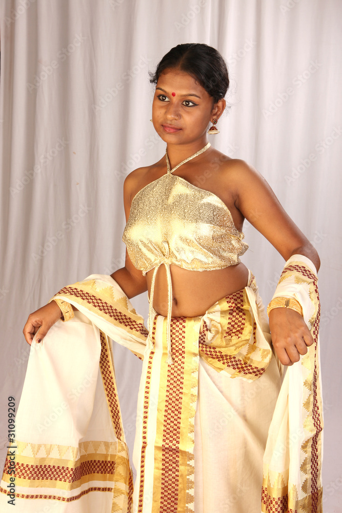 model displaying kerala kasavu mundu,strapless blouse Stock Photo | Adobe  Stock