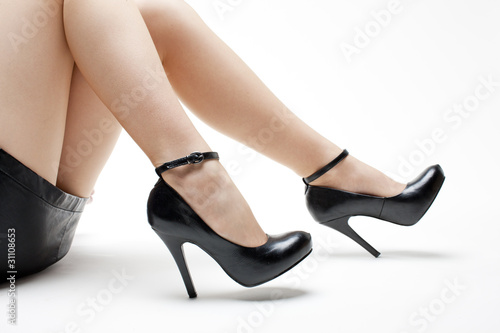 detail of lying woman wearing black shoes © Richard Semik