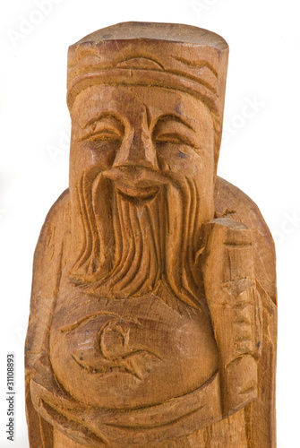 Wooden statue of a chinese wise man closeup