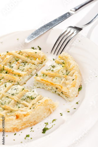 tasty quiche with cheese and herbs