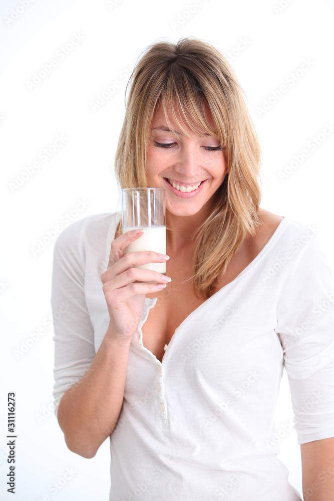Beautiful woman holding glass of milk Beautiful woman holding glass of milk