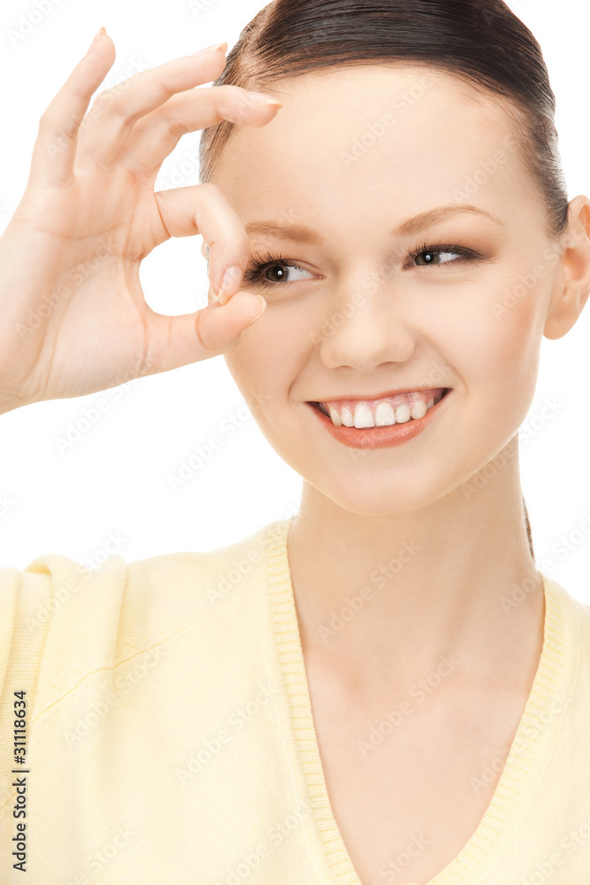 lovely woman looking through hole from fingers lovely woman looking through hole from fingers