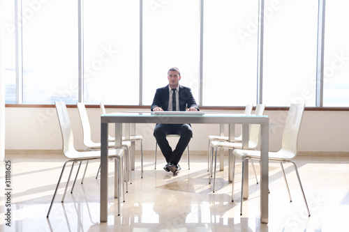 business man alone in conference room