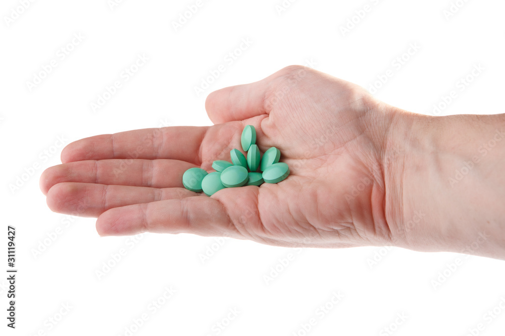 Hand with pills, isolated on white background Hand with pills, isolated on white background