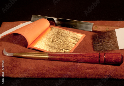 a booklet of pure gold leaf for gilding with craftsman's tools