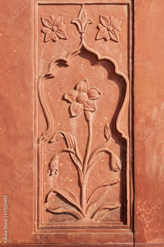 Flower stone carving in red sandstone at Red Fort.
