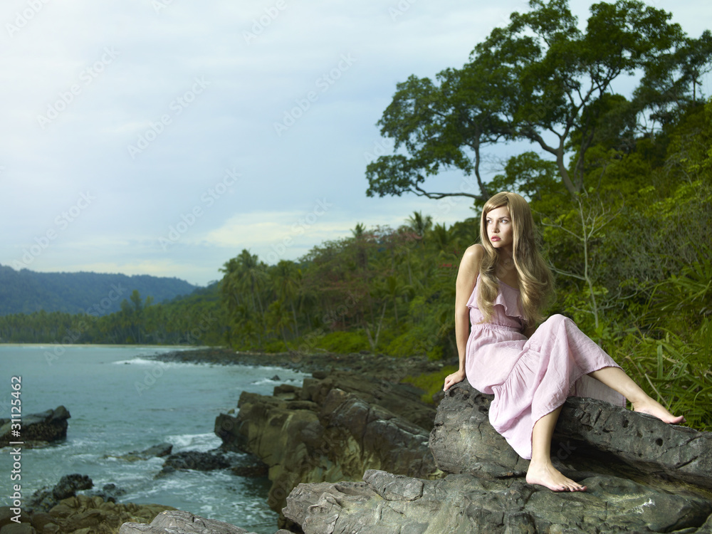 Beautiful woman on a rocky seashore Beautiful woman on a rocky seashore