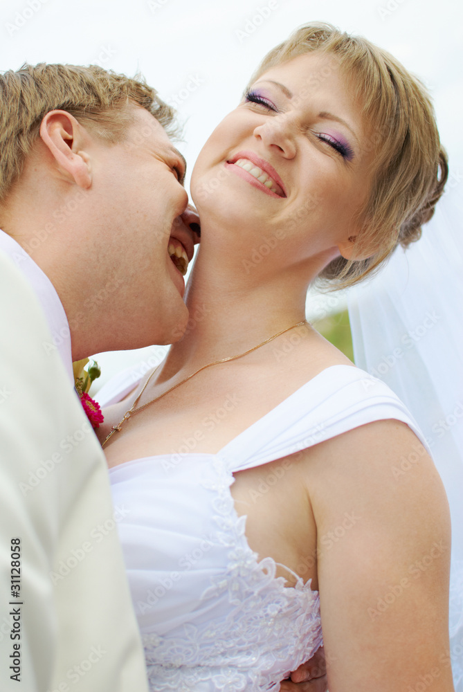 bride and groom fooling with funny expressions bride and groom fooling with funny expressions