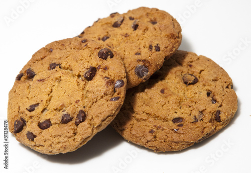 A stack of three chocolate chip cookies