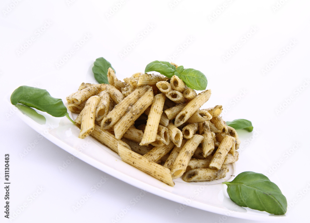 Penne with pesto decorated with basil Penne with pesto decorated with basil
