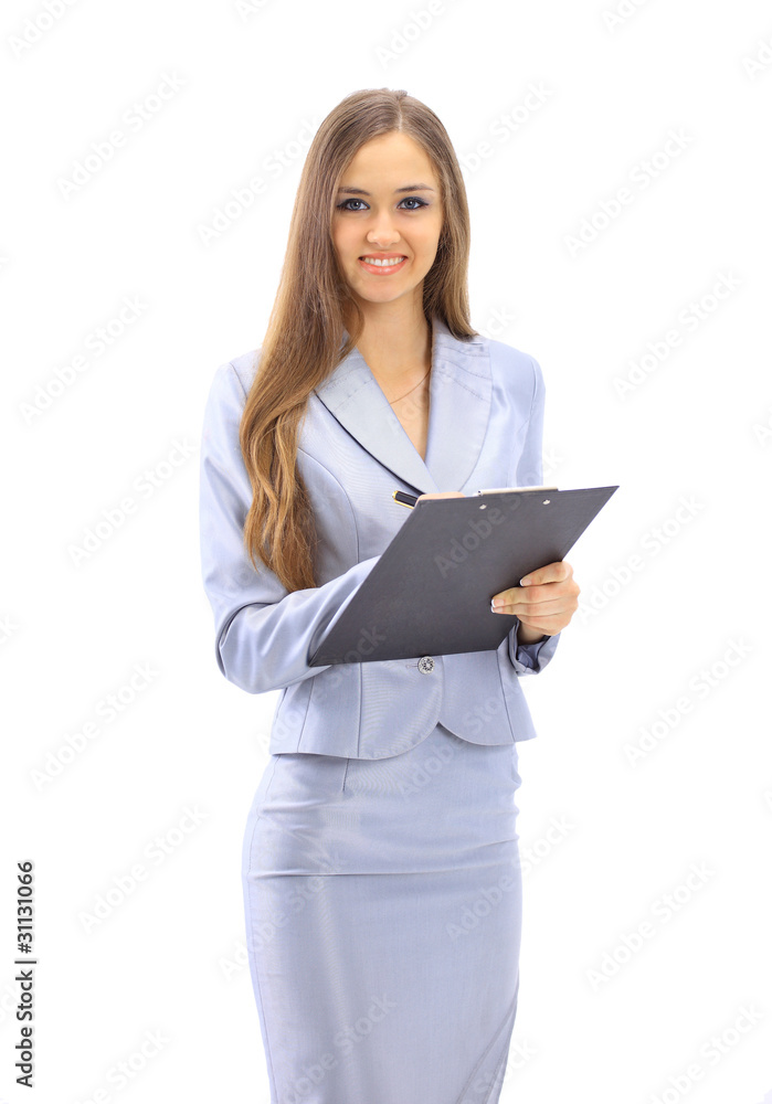 The beautiful business woman writes on a white background The beautiful business woman writes on a white background