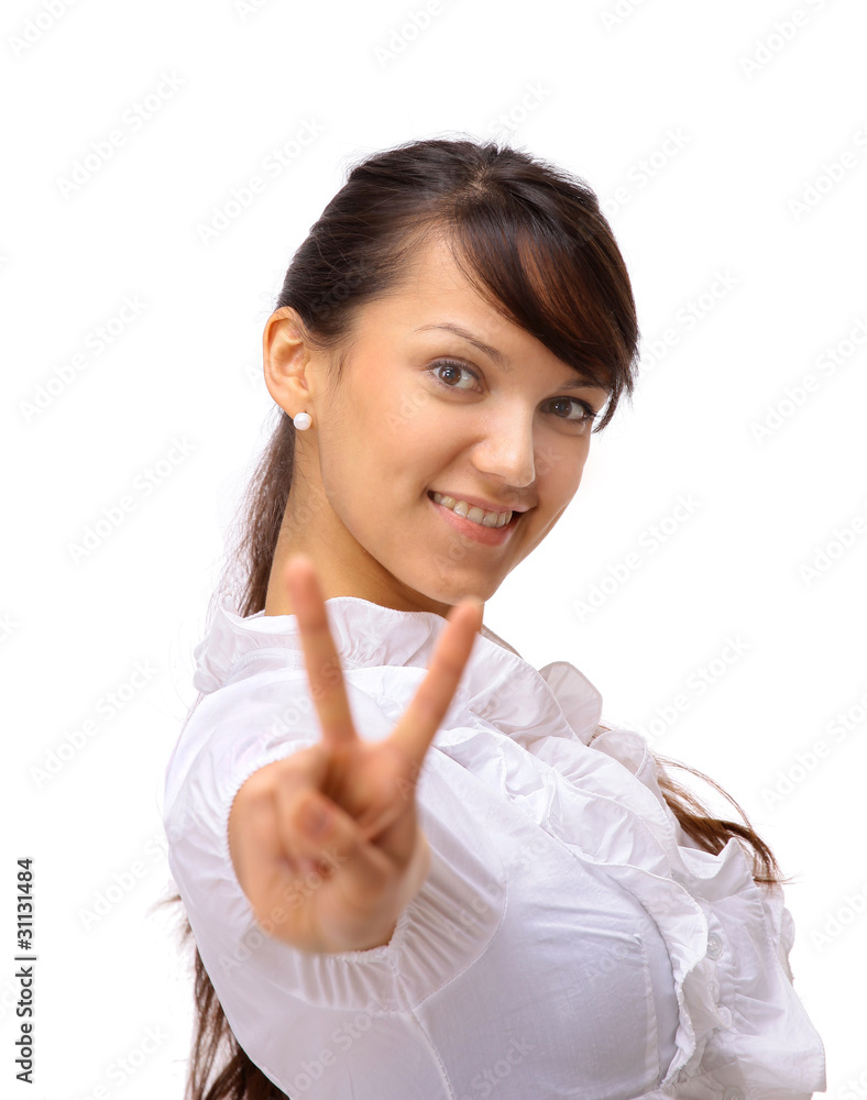 The beautiful business woman shows a symbol on a The beautiful business woman shows a symbol on a