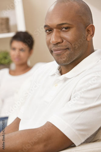 Happy African American Man Woman Couple Sitting At Home © Darren Baker