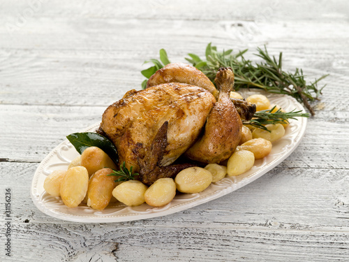 roasted chicken  with potatoes-pollo arrosto e patate photo