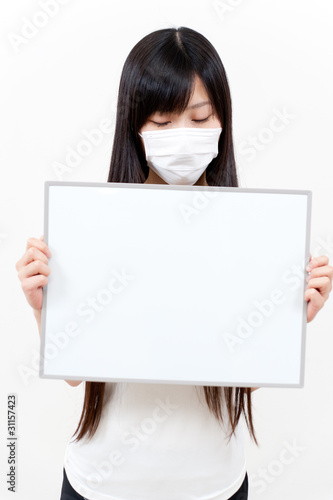 beautiful asian woman holding a blank whiteboad photo