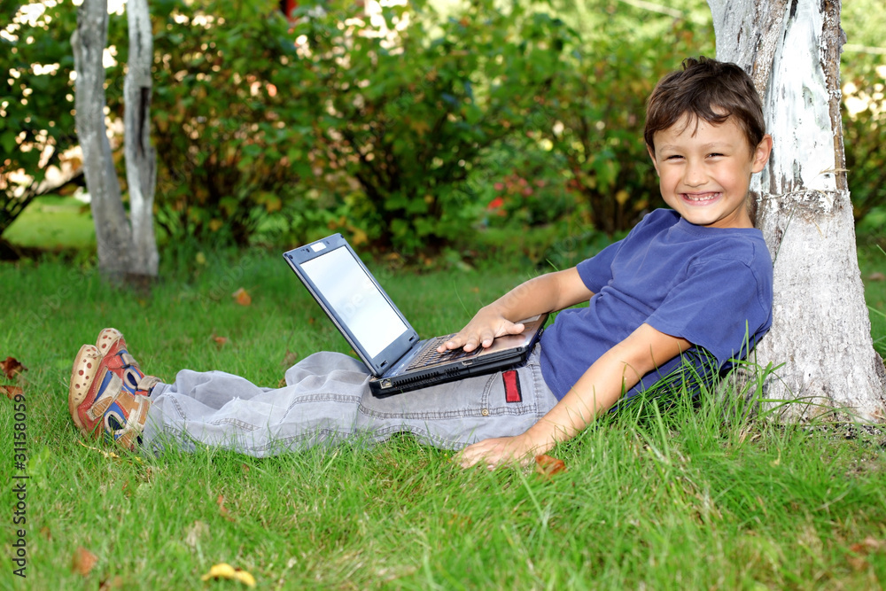 boy with notebook sit at tree outdoors boy with notebook sit at tree outdoors