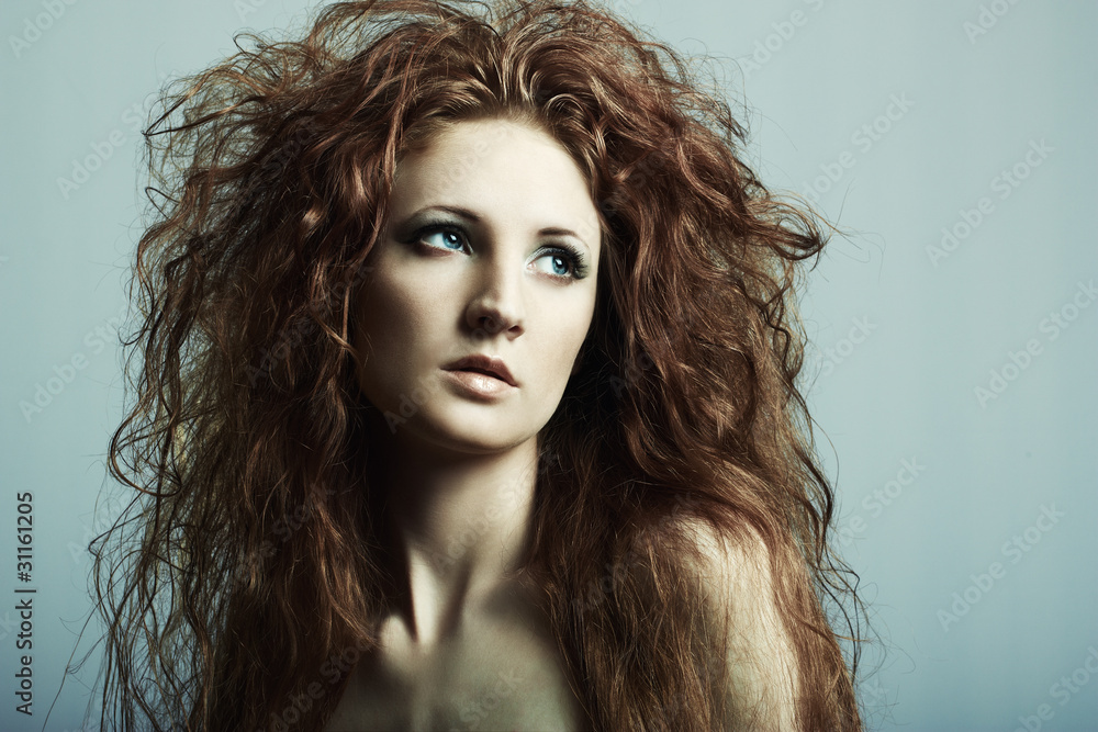 Naklejka premium Fashion portrait of a young beautiful redheaded woman