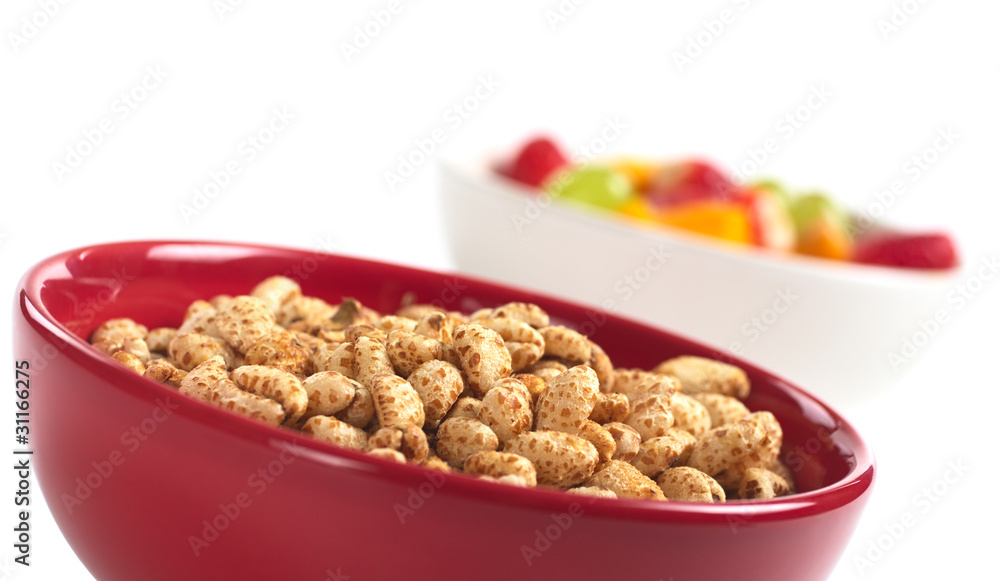 Puffed wheat cereal in red bowl with fruits Puffed wheat cereal in red bowl with fruits