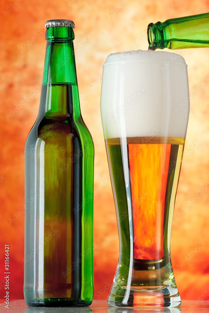 Bottle glass of beer on a yellow background Bottle glass of beer on a yellow background