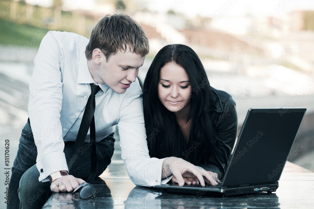Young couple working on laptop Young couple working on laptop
