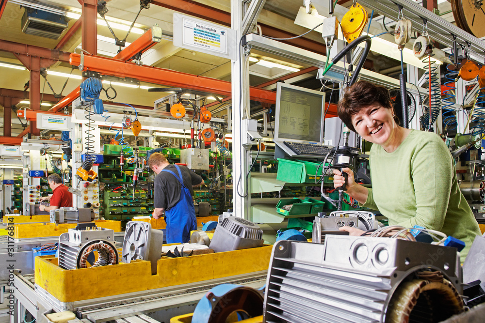 Fototapeta premium final assembly of electric motors by skilled industrial workers