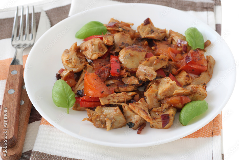 cut fried chicken with tomato and basil