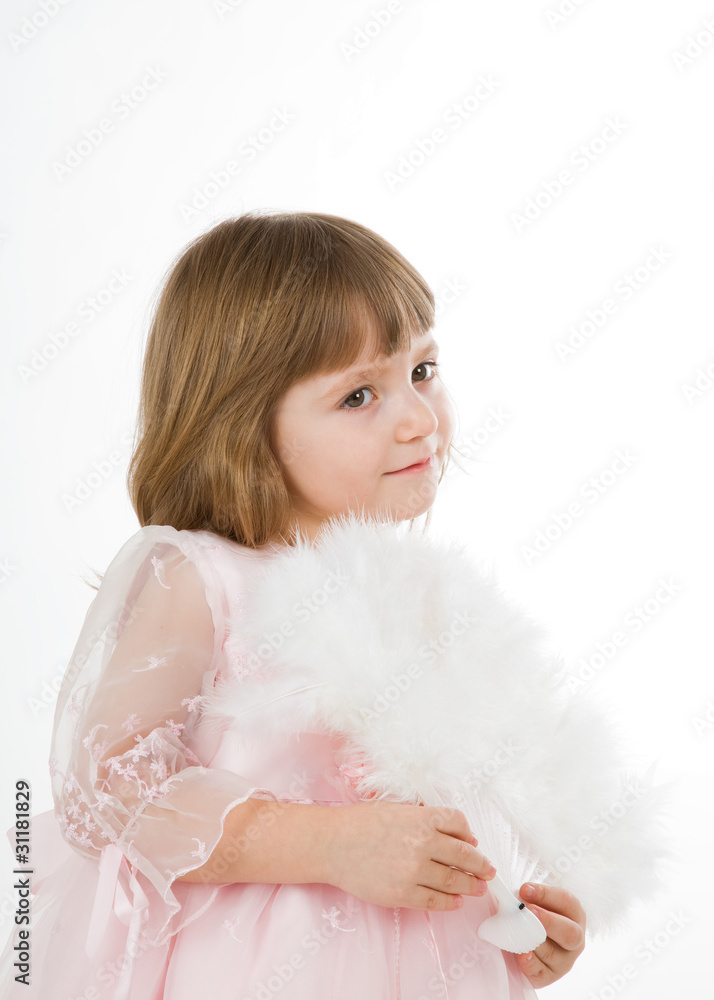 four-year girl in a beautiful pink dress with a fan. four-year girl in a beautiful pink dress with a fan.