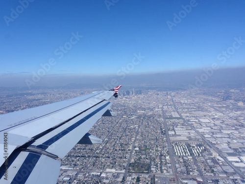 Looking out at a Airplane Wing with View of Downtown LA