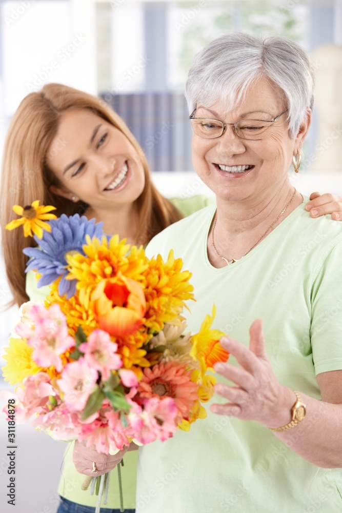 Elderly woman and daughter smiling happily Elderly woman and daughter smiling happily