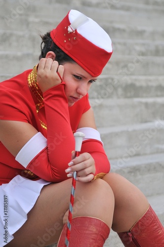 Majorette - unhappy teen in uniform photo