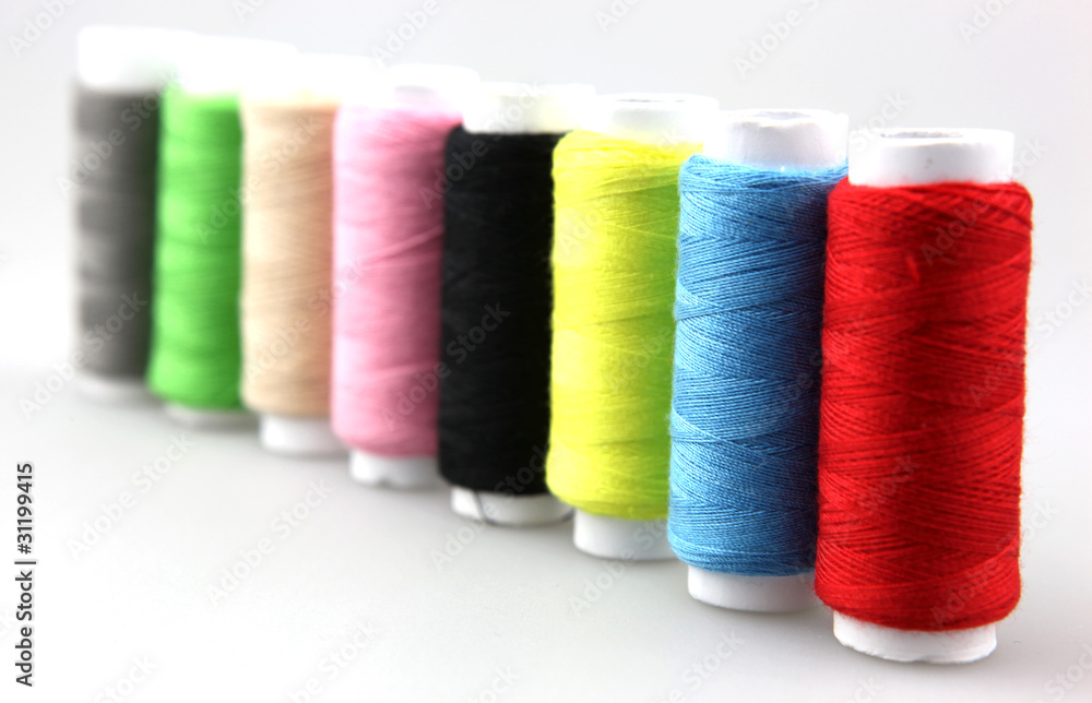 Set of colorful spools of thread isolated on white background Set of colorful spools of thread isolated on white background