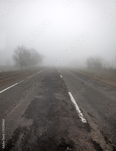 Ukrainian road in fog time.