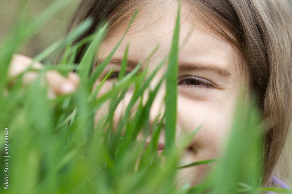 closeup portrait of little girl on green grass closeup portrait of little girl on green grass