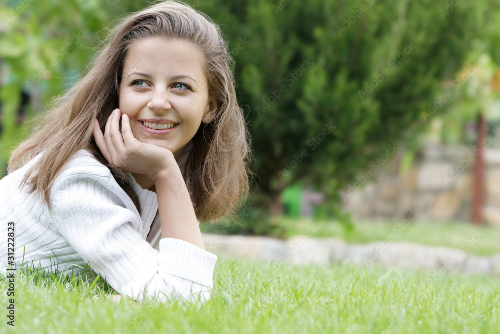 young happy woman resting on natural background young happy woman resting on natural background